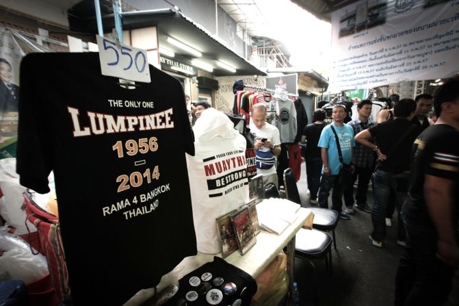 Vendors outside Lumpinee Stadium capitalized on nostalgia by selling commemorative T-shirts, priced at 550 baht ($16.75). 