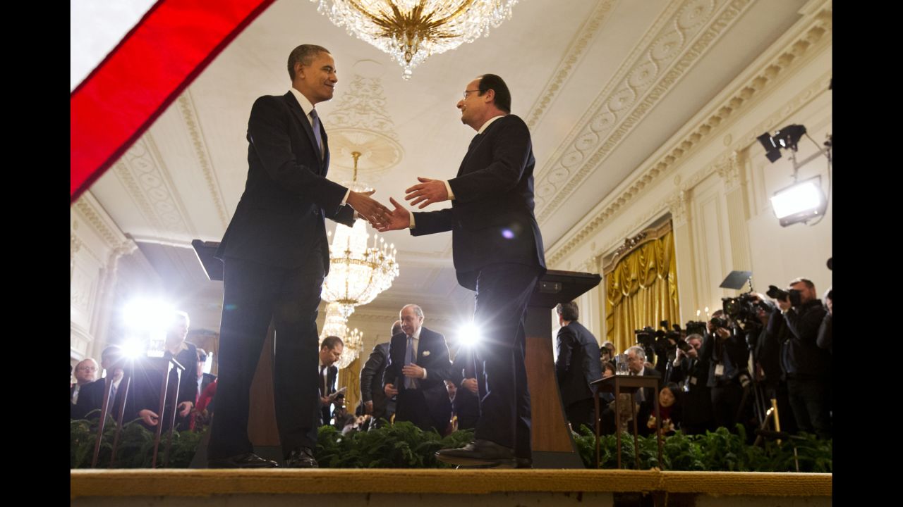 Obama shakes hands with Hollande after their news conference in the East Room of the White House in Washington. 