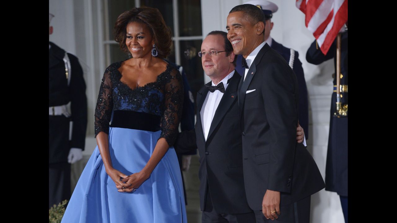 The President and the first lady pose with Hollande as he arrives for the state dinner at the North Portico of the White House.