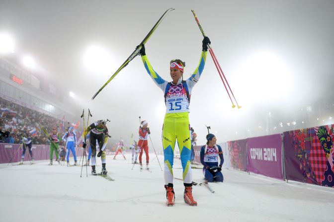 Biathlete Teja Gregorin of Slovenia celebrates after finishing the women's 10-kilometer pursuit on February 11.