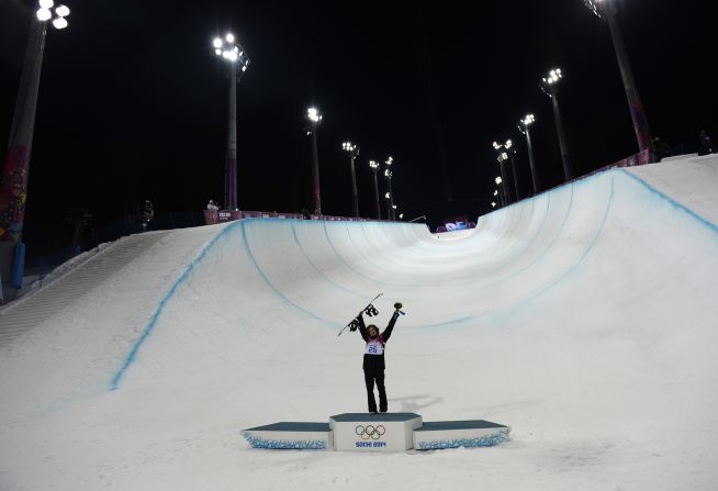 Halfpipe gold medalist Iouri Podladtchikov celebrates on the podium after the flower ceremony on February 11.