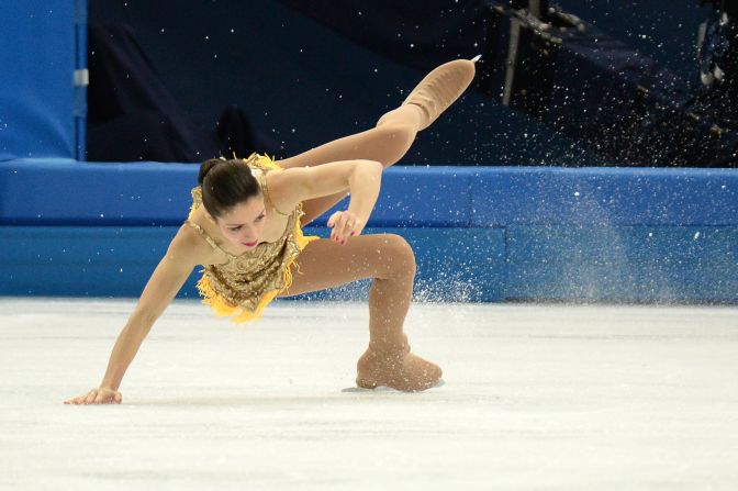 Italy's Stefania Berton falls as she performs in pairs figure skating on February 11.