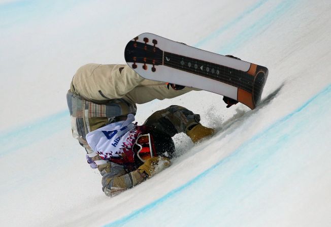 Danny Davis of the United States falls during his first run in the halfpipe finals on February 11.