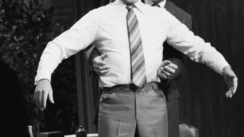 Dr. Henry Heimlich demonstrates the Heimlich maneuver on host Johnny Carson while appearing on "The Tonight Show" on April 4, 1979.
