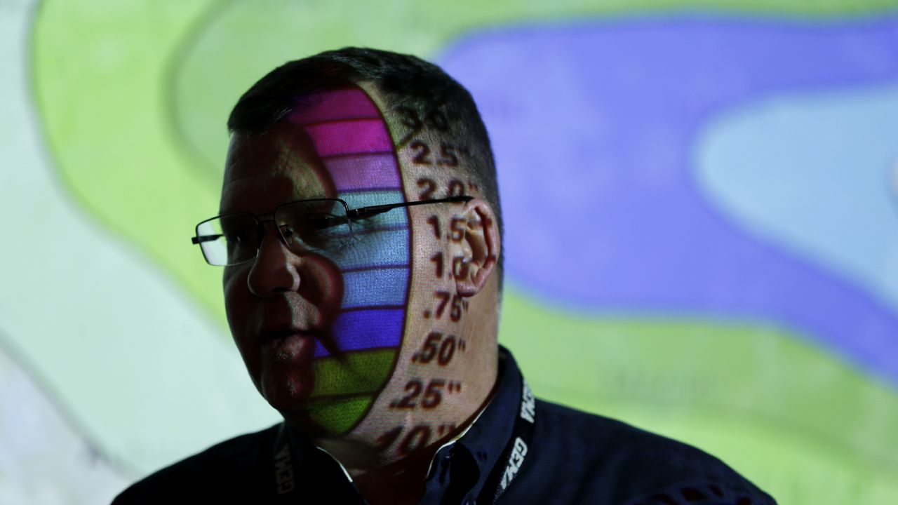 Weather data is projected onto the face of Clint Perkins, director of state operations for the Georgia Emergency Management Agency, as he works in Atlanta on February 11.