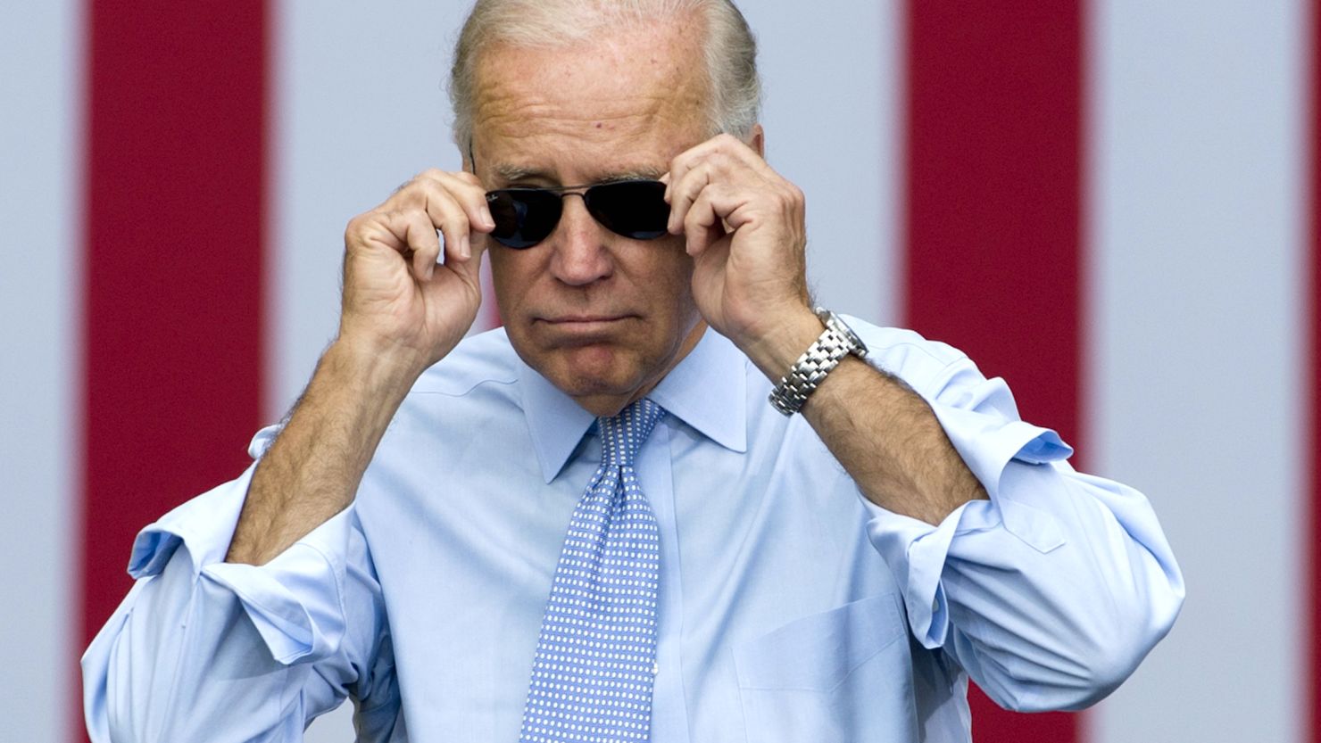Vice President Joe Biden takes his sunglasses off as he arrives for a campaign event with President Barack Obama in Portsmouth, New Hampshire on Sept. 7, 2012. 