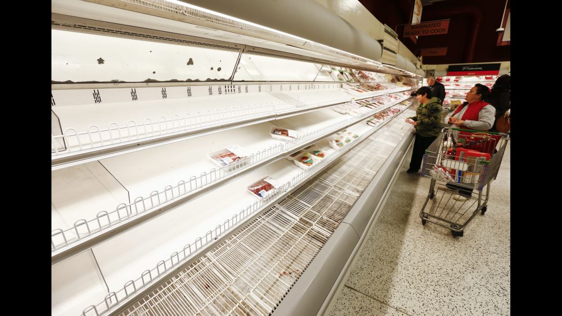 People shop for what is left at a Publix grocery store in Decatur, Georgia, on February 11.