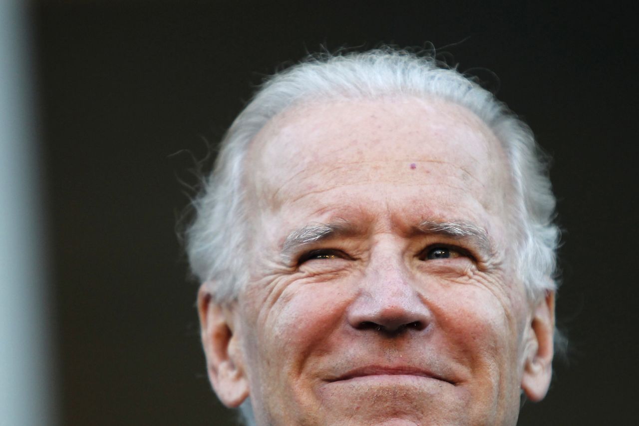 Joe Biden smiles on the steps of the State House in Concord, New Hampshire, in September 2012.