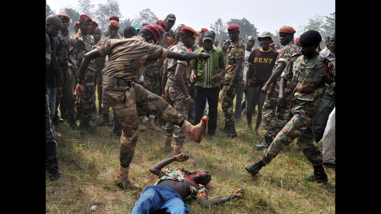 Members of the Central African Armed Forces lynch a man suspected of being a former Seleka rebel Wednesday, February 5, in Bangui.