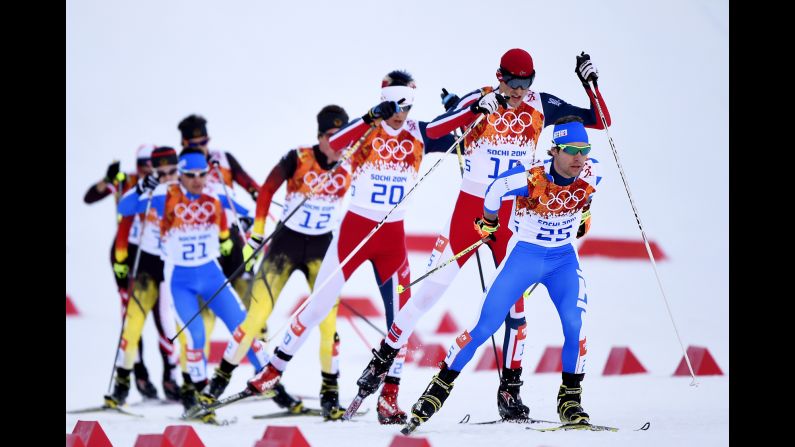 Alessandro Pittin of Italy leads a group of skiers during the cross-country portion of the men's Nordic combined event February 12.