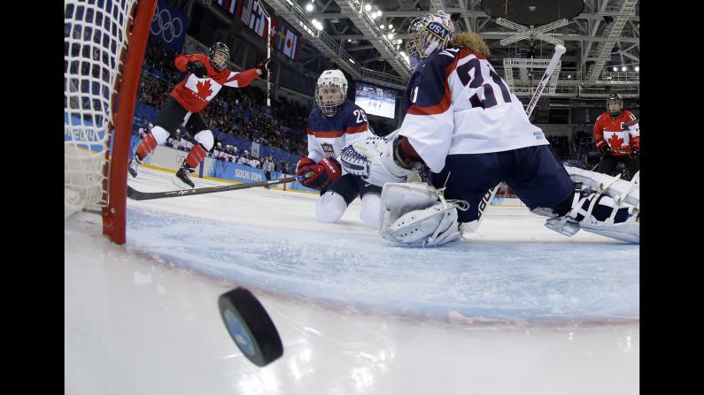 Canada's Meghan Agosta-Marciano, left, celebrates after scoring a goal against the United States.