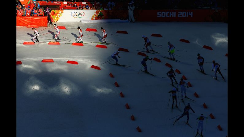 Athletes ski during the cross-country portion of the men's Nordic combined on February 12.