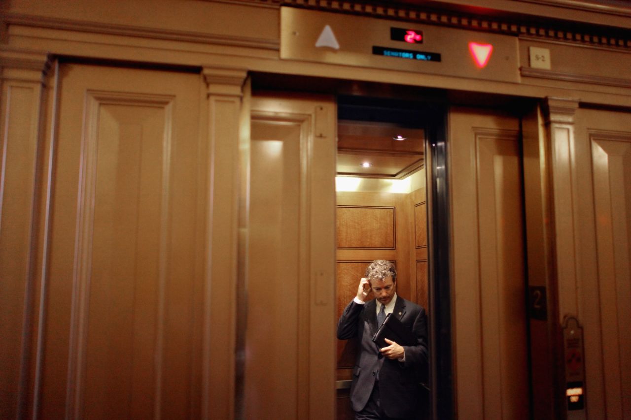 Paul boards an elevator after attending a Republican caucus meeting in Washington in July 2011.