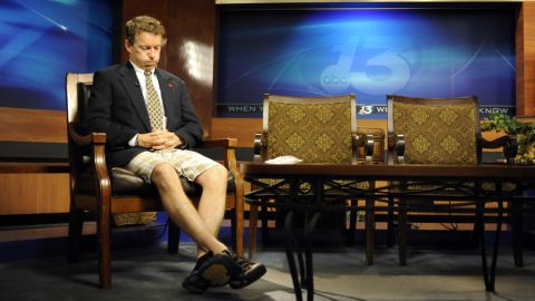 Coming from his son's soccer game, Paul wears shorts and a suit jacket while preparing for his guest spot on a Fox News television program in May 2010.