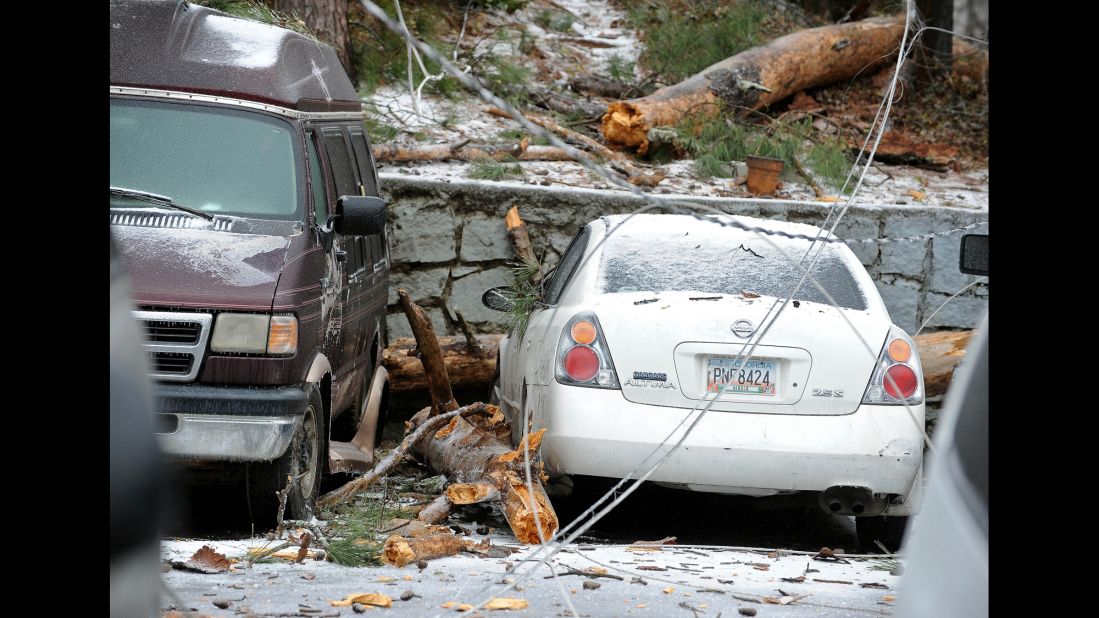 A downed power line is draped across several vehicles in Atlanta on February 12.