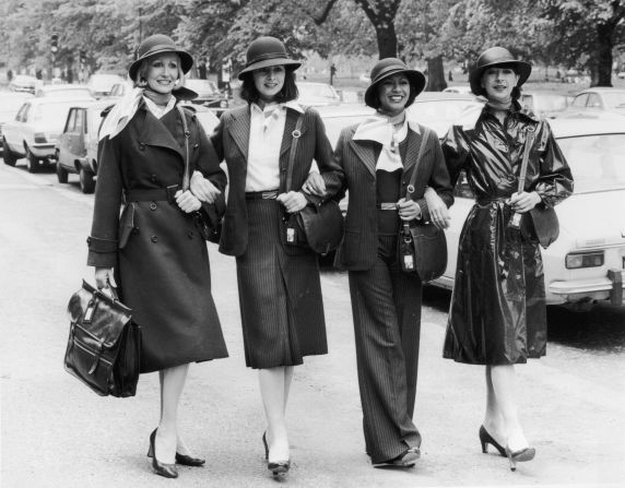 British Airways staff show off their new uniforms in 1977. Over the years, many airlines have commissioned outfits from top designers, such as Yves Saint Laurent for Qantas in the 1980s, Giorgio Armani for Alitalia in the 1990s, and Christian Lacroix for Air France in the 2000s. 