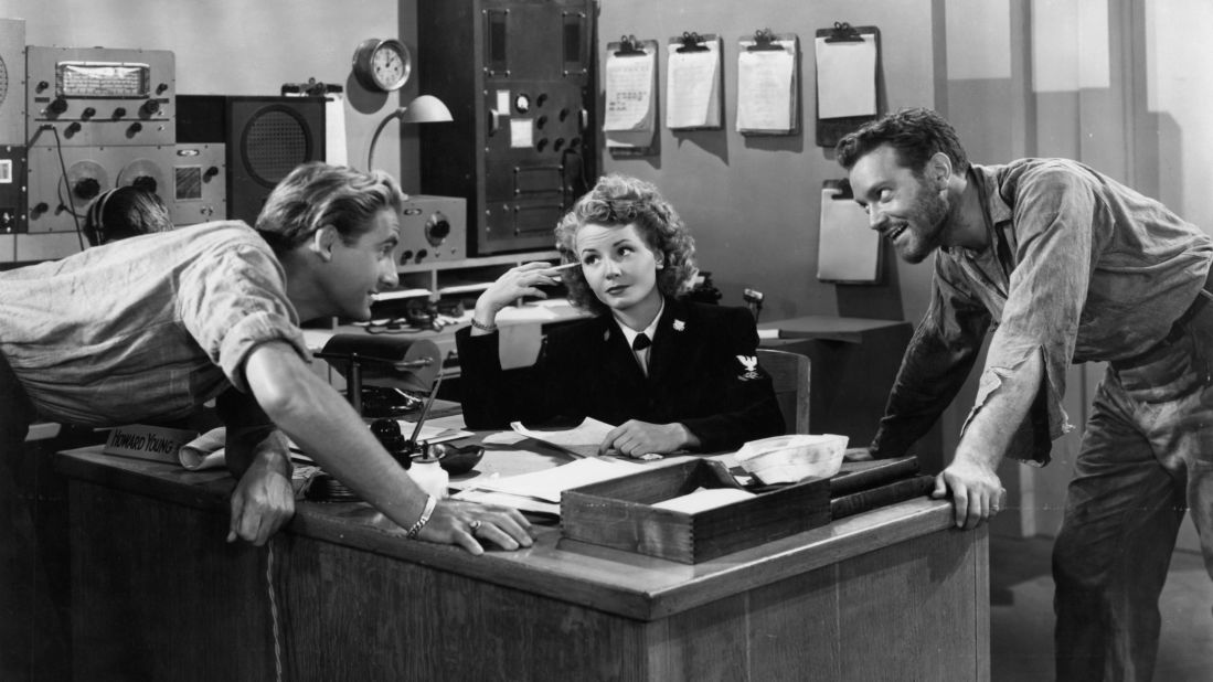 Caesar leans on table in front of Janet Blair and Alfred Drake in a scene from the 1946 film "Tars and Spars."