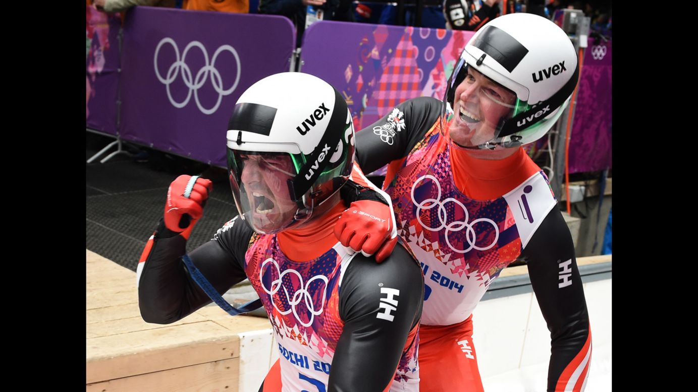 Austria's Andreas Linger, left, and Wolfgang Linger celebrate after their luge run on February 12. They won silver.