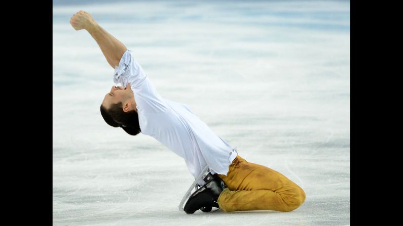 Maxim Trankov of Russia celebrates a gold-medal performance in pairs figure skating.