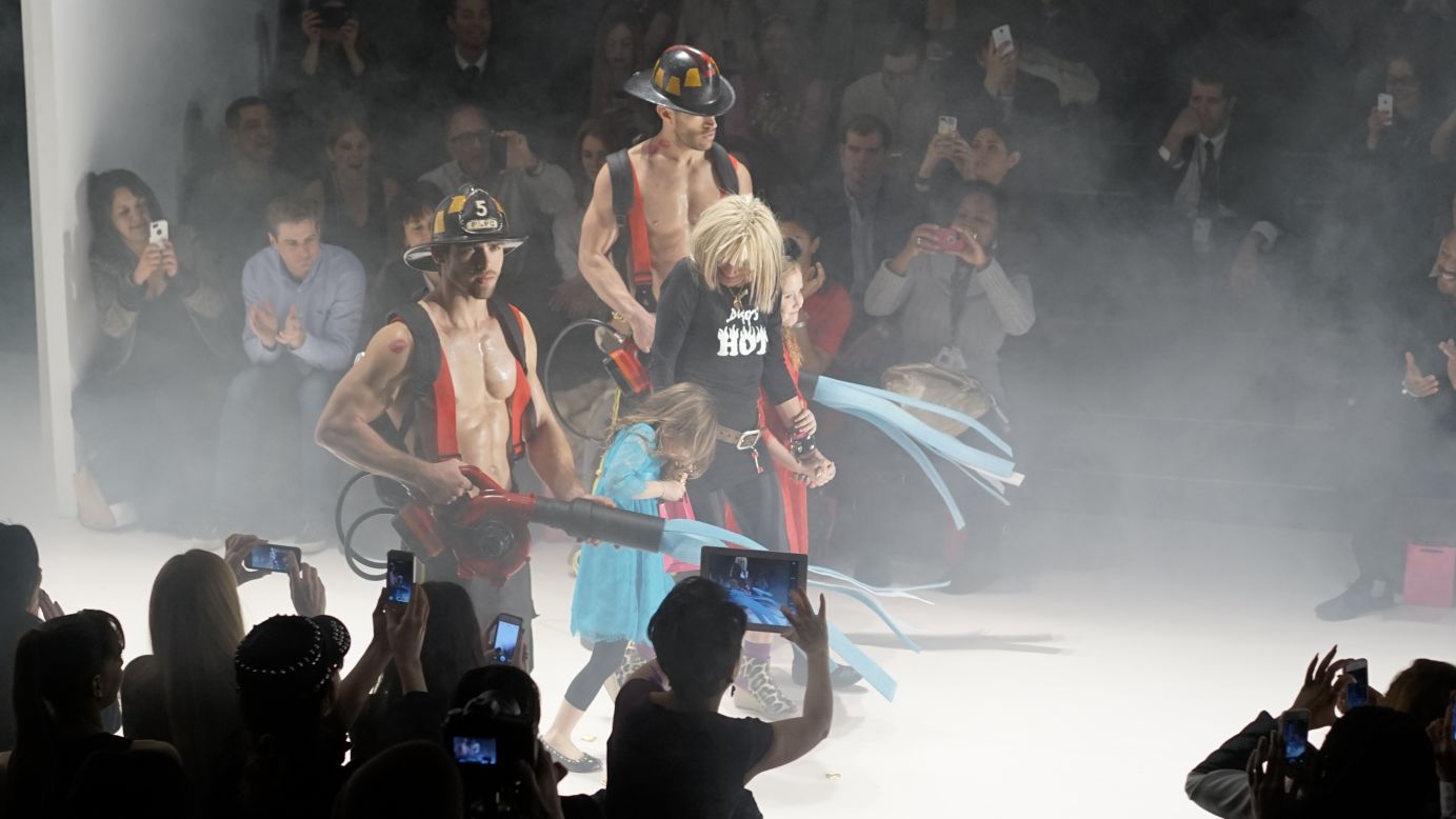 Betsey Johnson, who is 71 years old, showed her "Betsey's Hot" collection on February 12. Fittingly, she came out with firefighters (and her granddaughters!) at the end of the show.