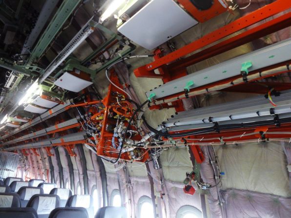 Instead of passenger seats, this aircraft is filled with flight testing instruments including the equivalent of 400 kilometers of testing cables. Everything color-coded orange is linked to flight testing and will eventually be removed from the plane.