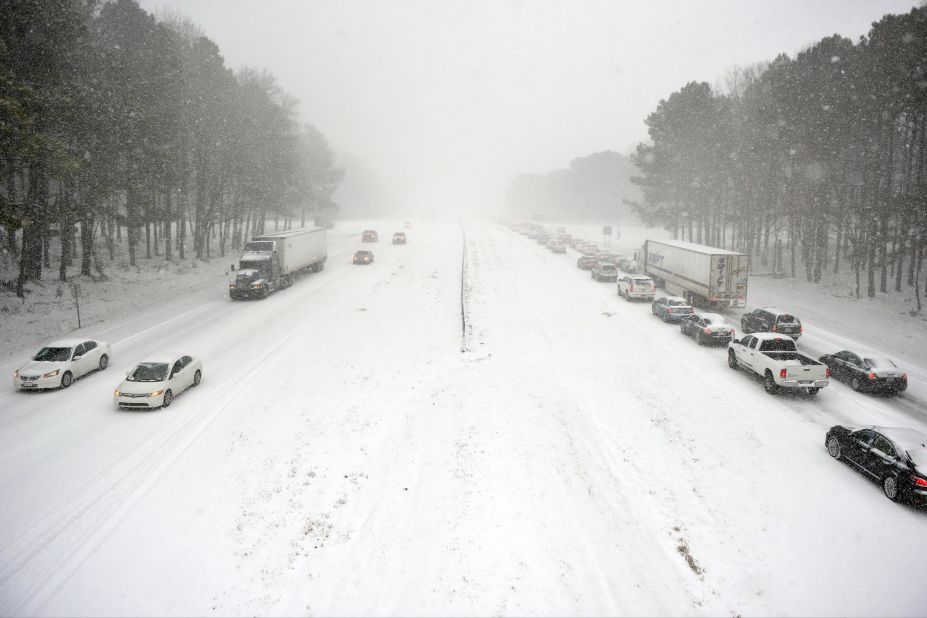 Traffic moves slowly along Wade Avenue in Raleigh on February 12. Motorists were encouraged to stay off roads.