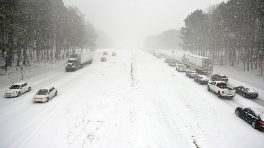 RALEIGH, NC - FEBRUARY 12: Traffic moves slowly along Wade Avenue on February 12, 2014 in Raleigh, North Carolina. Motorists were encouraged to stay off roads after Gov. Pat McCrory declared a state of emergency yesterday ahead of the winter storm. (Photo by Lance King/Getty Images)