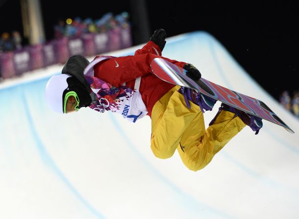 Chinese snowboarder Li Shuang holds her board during the women's halfpipe finals on February 12.