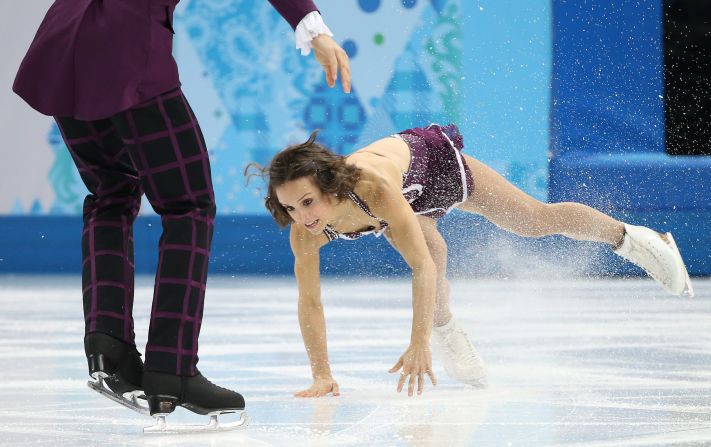 Canada's Meagan Duhamel falls during her free skating routine with Eric Radford on Wednesday, February 12.