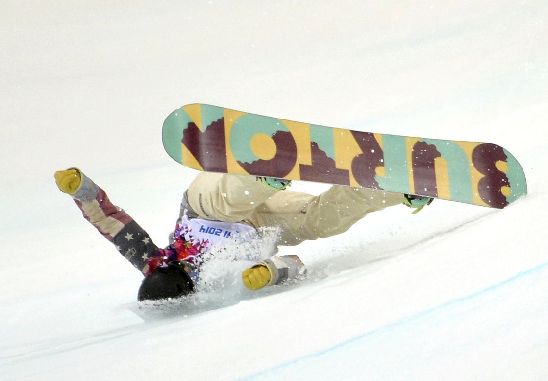 Kelly Clark of the United States falls during her first run in the women's halfpipe finals February 12.