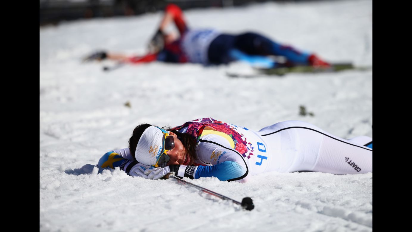 Cross-country skier Charlotte Kalla of Sweden reacts after crossing the finish line during the women's 10-kilometer classic on February 13.