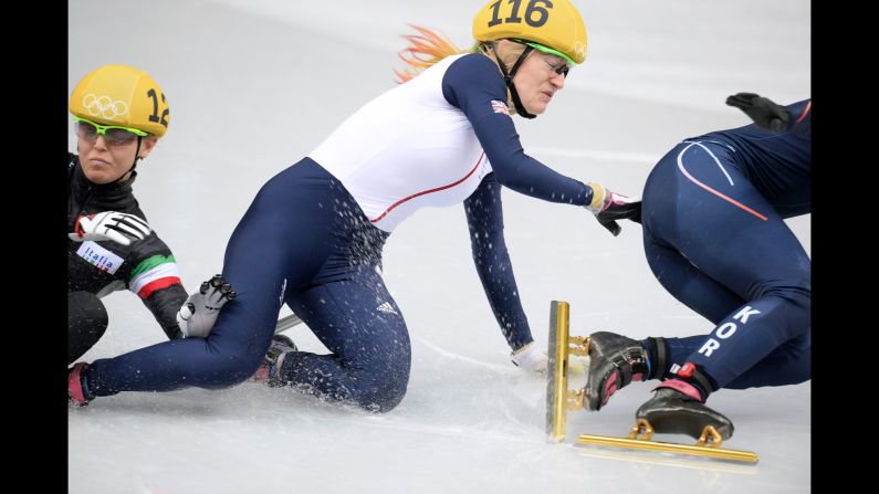 From left, Italy's Arianna Fontana, Great Britain's Elise Christie and South Korea's Park Seung-Hi fall as they compete in the 500-meter short track speedskating final on February 13.