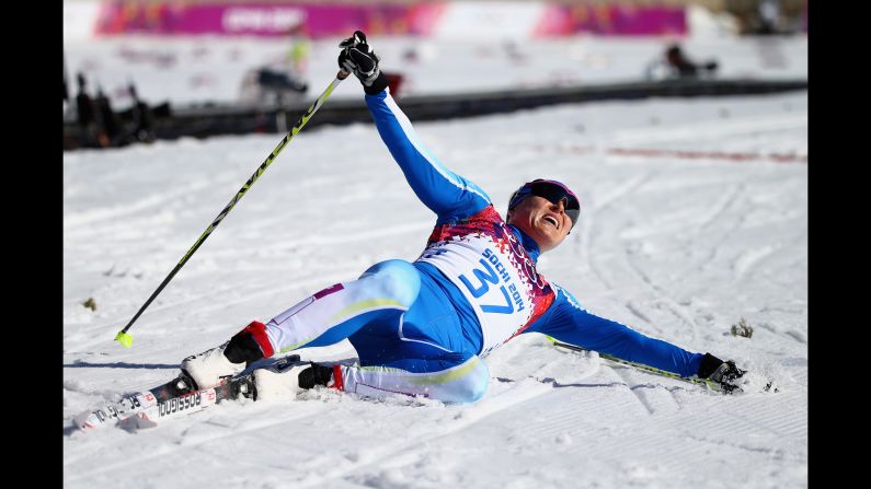 Aino-Kaisa Saarinen of Finland reacts after crossing the finish line during the women's 10-kilometer classic.