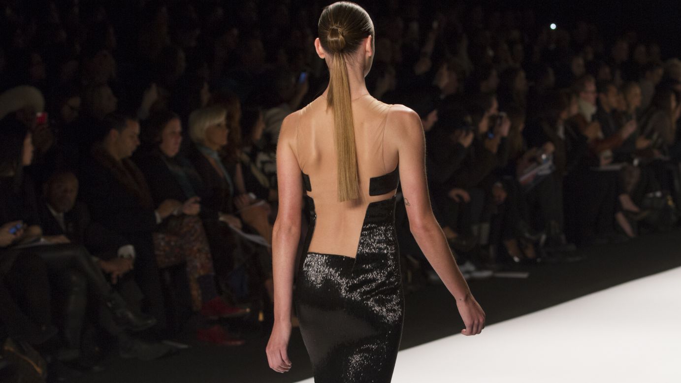 A model walked graced the runway in a little black dress with an edgy open back.