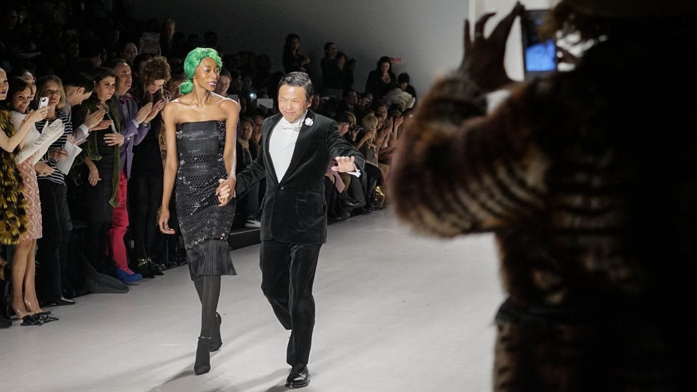 After the last outfit, Zang Toi took his turn down the runway with the green-haired model.