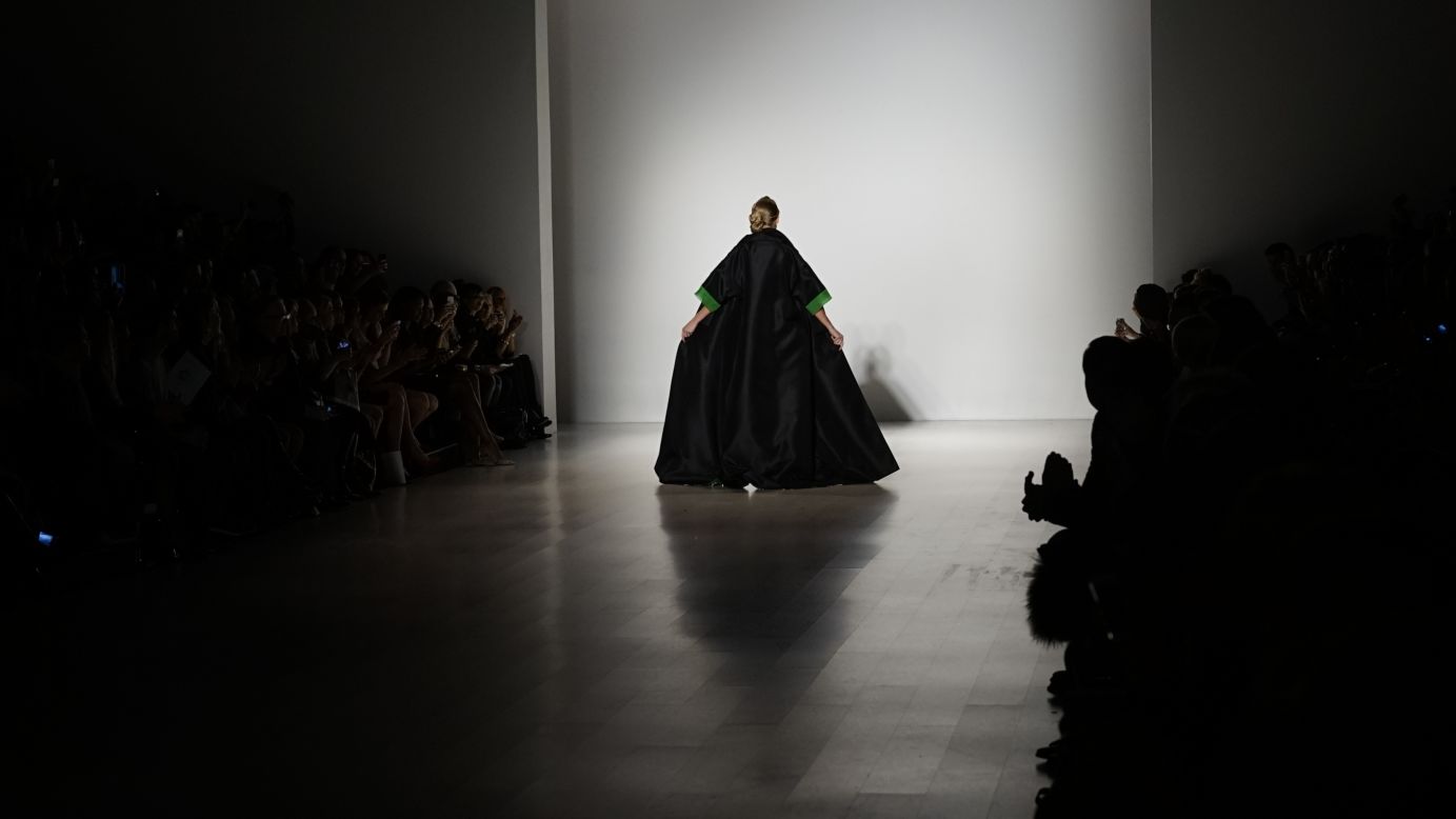 For a flashy finish, Zang Toi paired a sleek, black silk gown with a Kelly green-lined, full-length cape coat.