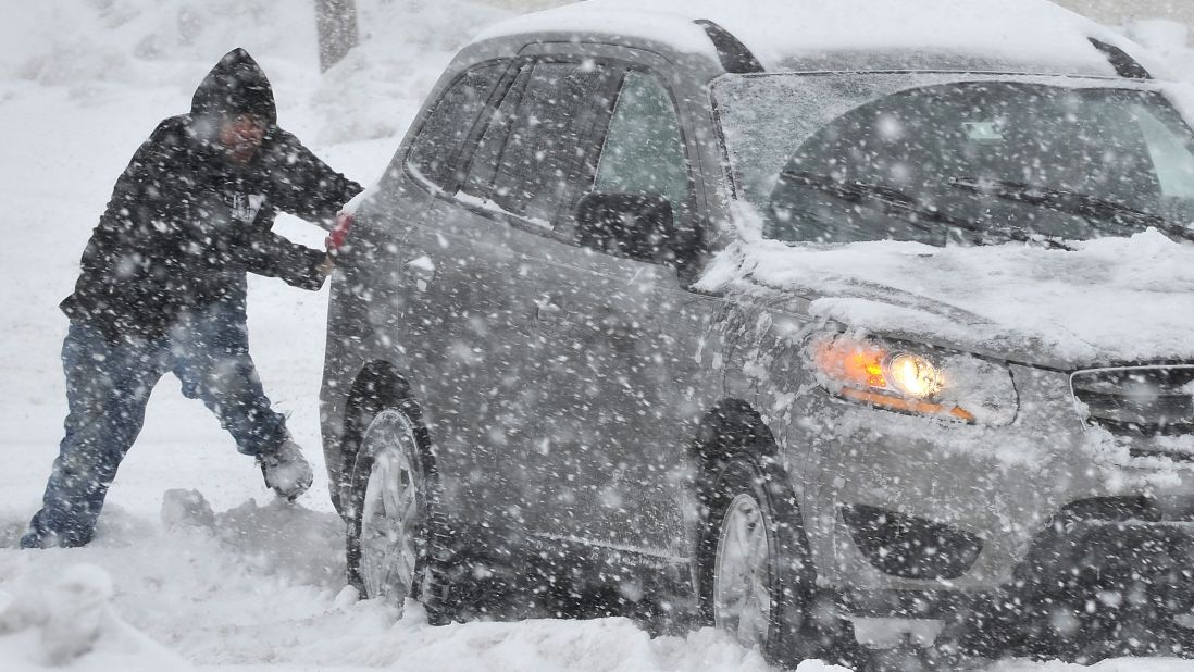 A man in Bethlehem helps push a stranded motorist February 13.