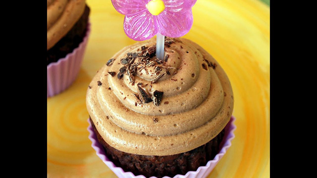 Vitamin- and fiber-rich canned pumpkin, which offers protection against heart disease, serves as an excellent substitute for butter or oil in these cupcakes. 