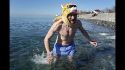 A man swims in the Black Sea outside the Olympic Park in Sochi on February 13.