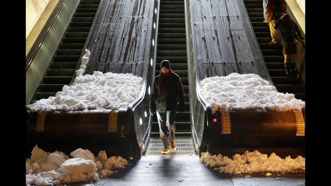 Snow collects at the base of escalators at the Dupont Circle Metro Station in Washington on February 13.