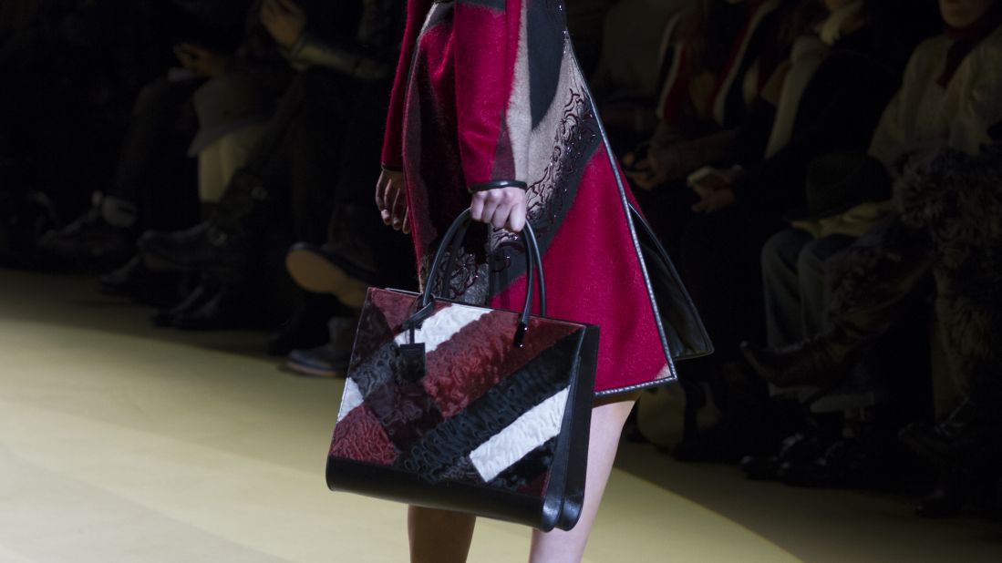 J. Mendel complemented this fall ensemble with a red, black and white color-blocked tote.