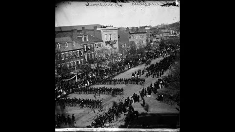 After his assassination, Abraham Lincoln's funeral procession moves down Pennsylvania Avenue in  Washington on April 19, 1865. His body was taken by funeral train to be buried in his hometown of Springfield, Illinois.