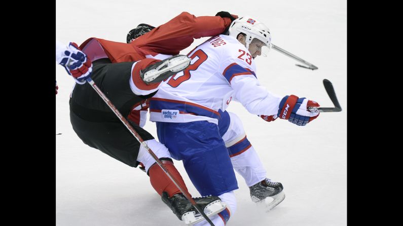Norway's Mats Trygg collides with Canada's Sidney Crosby during a men's hockey game on February 13.