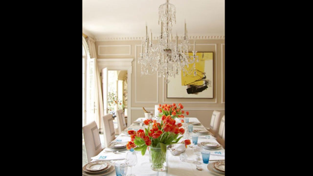 This dining room, designed by Miles Redd, from the March/April 2013 issue of Veranda, puts the focus on a magnificent chandelier to cast a soft, romantic glow over dinner.