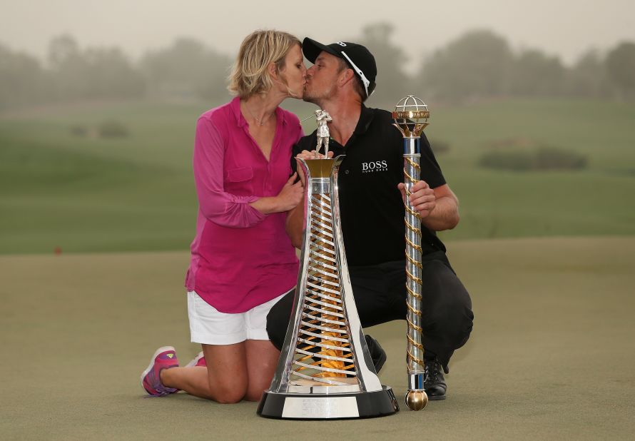 Stenson and his wife Emma enjoy a kiss on the 18th green following his win at the DP World Tour Championship in Dubai in November. The win ensured he finished top of the tree in Europe in 2013.  