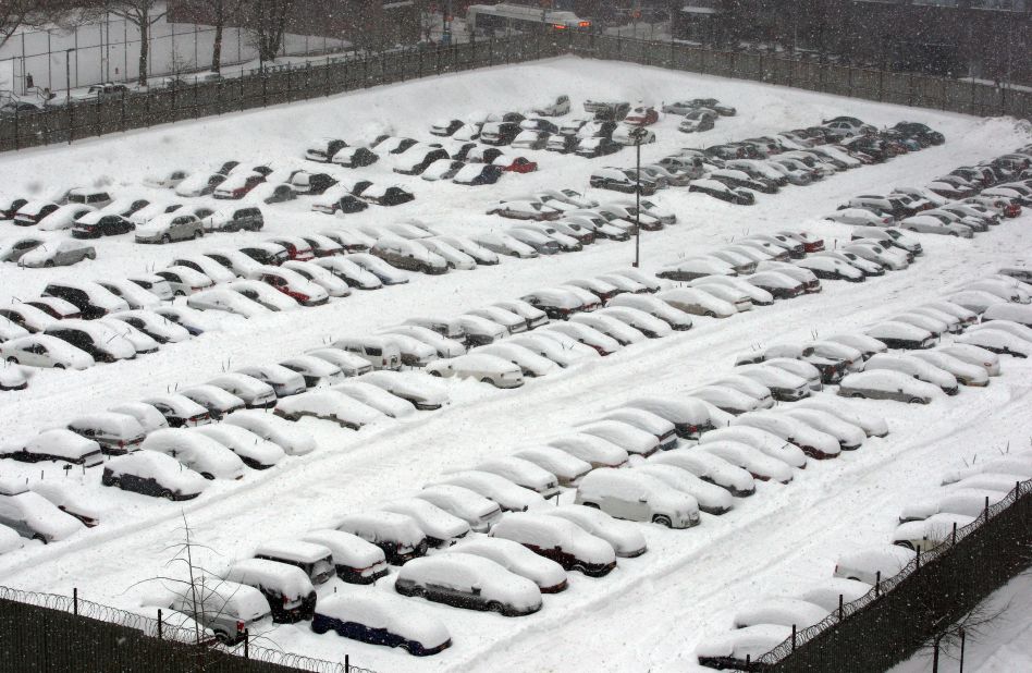 Snow covers cars in Brooklyn on February 13.