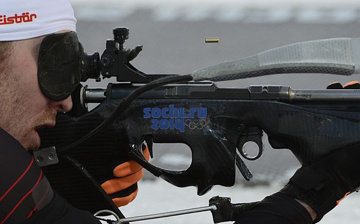 Simon Eder of Austria takes aim Thursday, February 13, during the men's 20-kilometer biathlon.