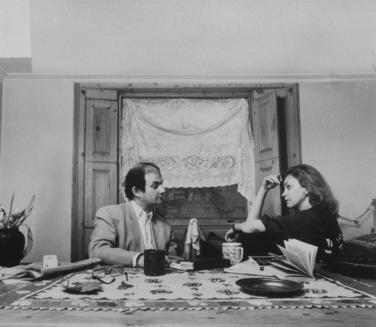February 14 marks 25 years since Iran's Ayatollah Khomeini called for the death of author Salman Rushdie over his novel "The Satanic Verses." Here Rusdhie and wife Marianne Wiggins talk after going into hiding in February 1989.