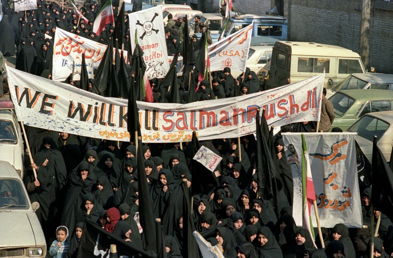 Thousands of people demonstrate in Tehran after the religious decree, or fatwa, was issued by Ayatollah Khomeini calling Rushdie a blasphemer and his book "The Satanic Verses" an insult on Islam and the Prophet Muhammad, therefore condemned to death. 
