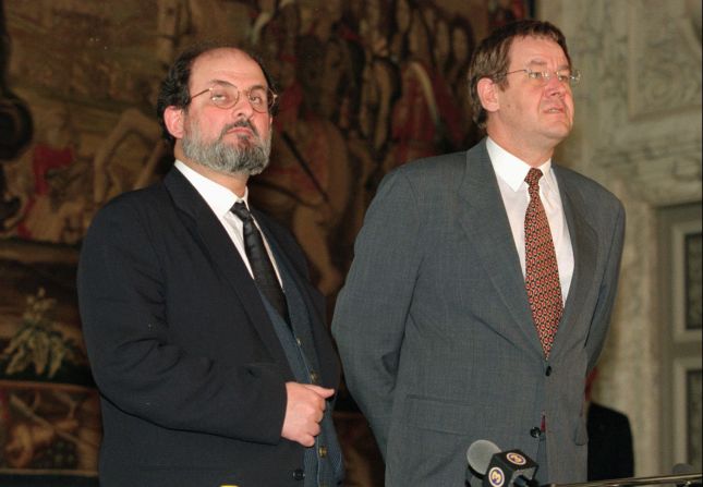 Rushdie and Danish Prime Minister Poul Nyrup Rasmussen talk to the press at Christiansborg Castle in Copenhagen on November 13, 1996. Rushdie traveled to Copenhagen to receive a literary award after the Danish government canceled earlier plans because of a threat to Rushdie's life. 